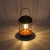 Solarlaterne 'Lighthouse', Schwarz, Metall, Höhe 26 Cm 2 Solarlaterne 'Lighthouse', Schwarz, Metall, Höhe 26 Cm -Pflanzen Geschäft 2950100609 Solar Metall Tischlampe Modell Lighthous 1 96754